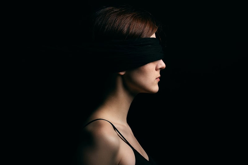 Wearing blindfold in front of an adult video store