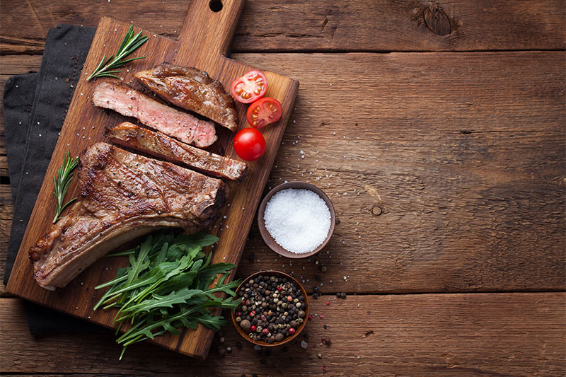 Food Served on a Wooden Boards red meat beef