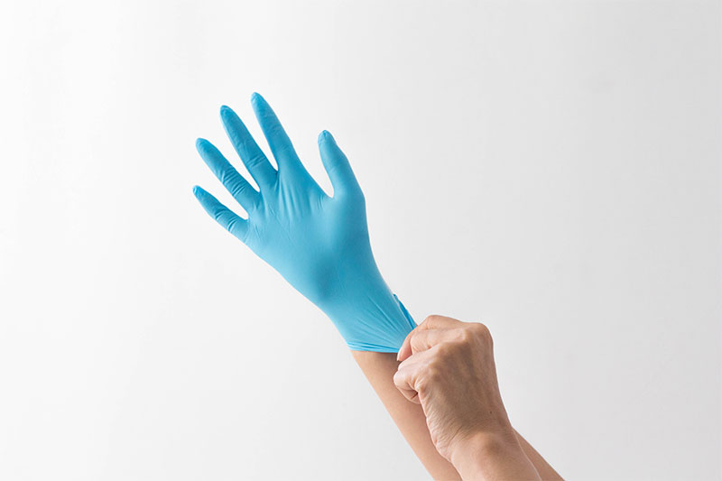 wearing protective gloves